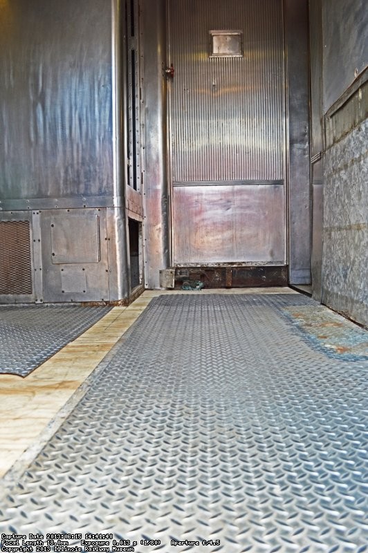 The metal floor was reinstalled - note that there is a cabinet missing as it probably had been removed when the ice cream parlor had installed the door.