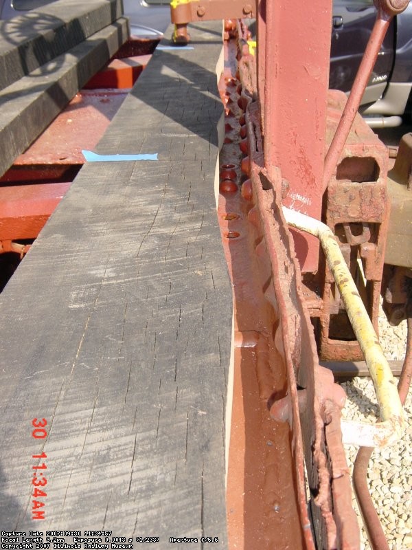 09.30.07 - THE ENDSILL IS BENT BADLY AND THE FINAL DECK BOARD HAD TO BE SCRIBED AND CUT TO FIT.  THE BOARD HAS NOT BEEN PLACED IN ITS FINAL POSITION AGAINST THE ENDSILL.  DADOS HAD TO BE CUT FOR PROTRUDING RIVETS ON THE BOTTOM OF THE BOARD AND HOLES HAD TO BE DRILLED FOR RIVETS WHICH PROTRUDED ON THE ENDS AND ONE EDGE OF THE DECK BOARD. 