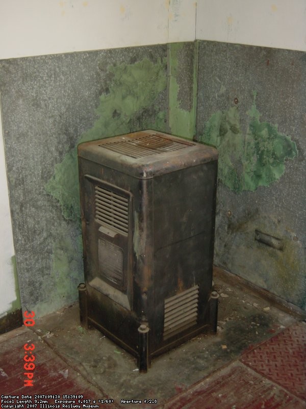 09.30.07 - KIRK WARNER HAS REAPPLIED THE INSULLATION AND HEAT SHIELD BEHIND THE STOVE.