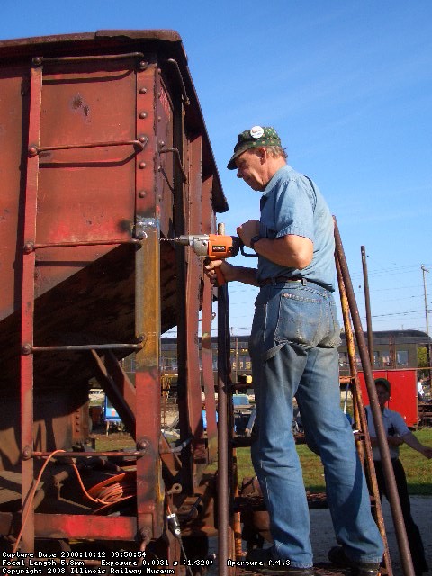 10.12.08 - BOB KUTELLA IS DRILLING ANOTHER HOLE TO MOUNT THE HANDHOLD TO THE REPLACED VERTICAL SUPPORT.