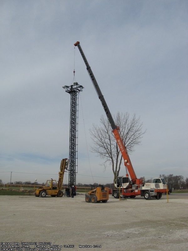 Working together, the crane and forklift get the job done.