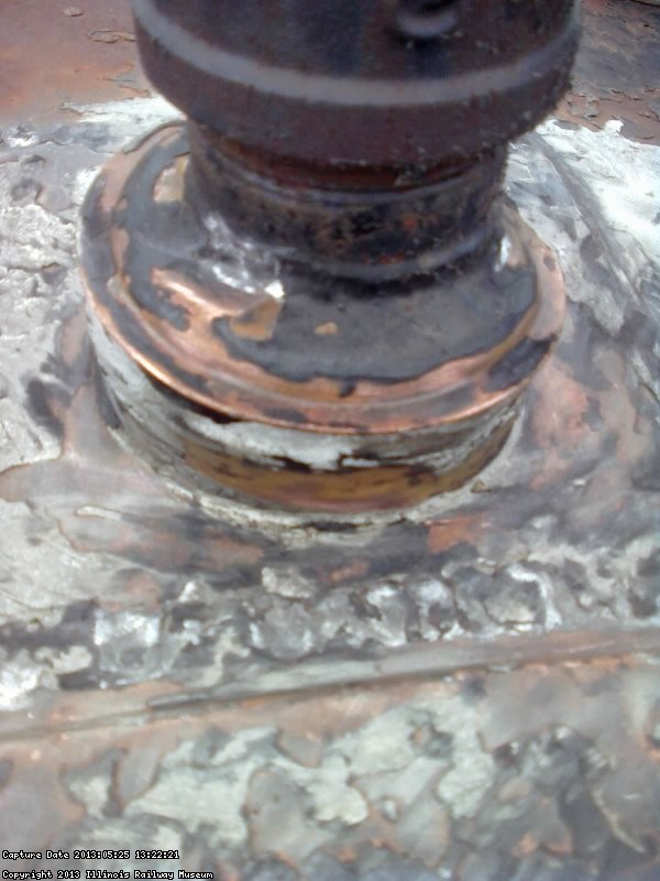 Closeup of flashings around the kitchen water tank fill pipe