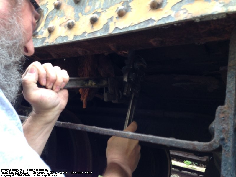 Chuck Trabert used two wrenches to open the boiler drain