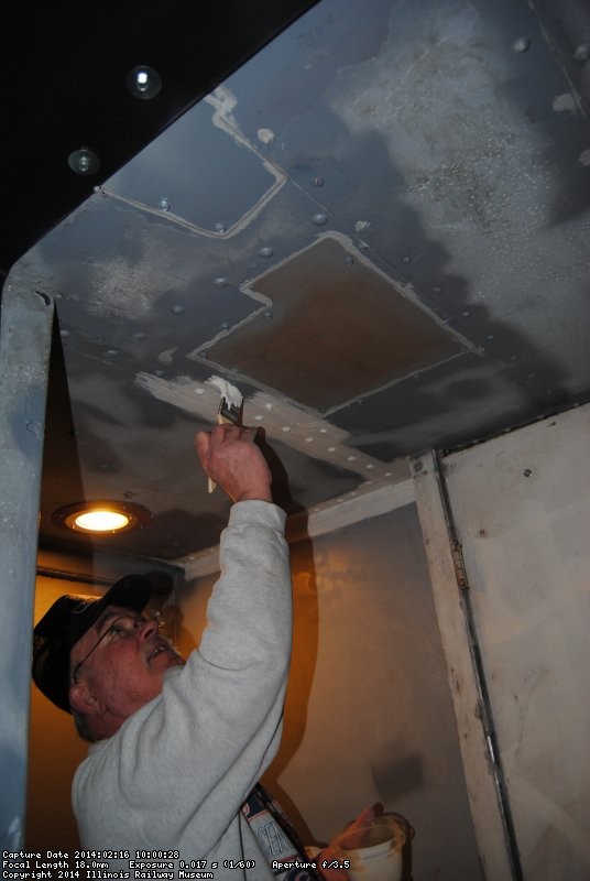 Kevin Kriebs applying primer to ceiling in the vestibule between the Exhibit Cars 2/16/14
