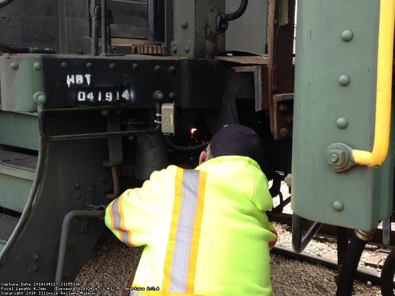 Ray cutting off a broken bracket that was holding the steam heat line on Lackawanna 651. It was repaired.