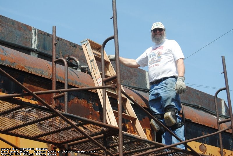 Chuck Trabert patching the X-5000 roof - Photo by Shelly Vanderschaegen