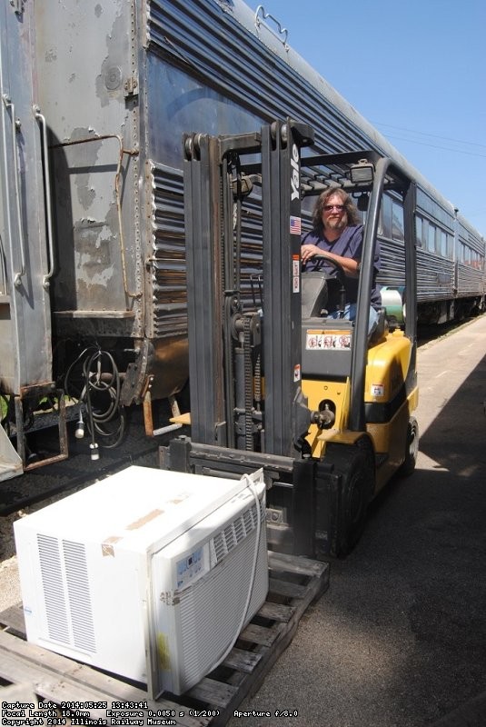 Jeff Calendine drove the fork lift for the air conditioners - Photo by Shelly Vanderschaegen 