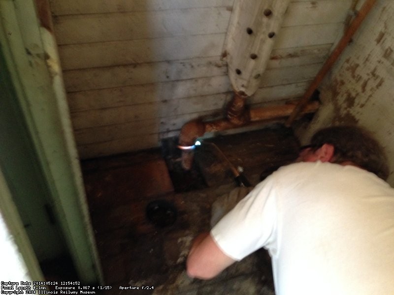 Chuck heating a pipe in the X-5000 to remove it - Photo by Warren Newhauser