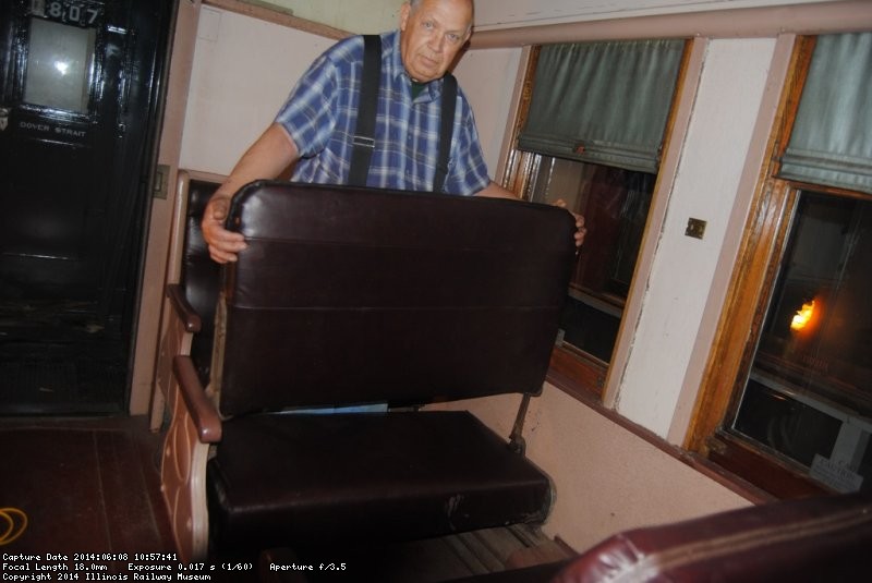 John McKelvey installing a walkover seat back in the DMIR 84 - Photo by Shelly Vanderschaegen