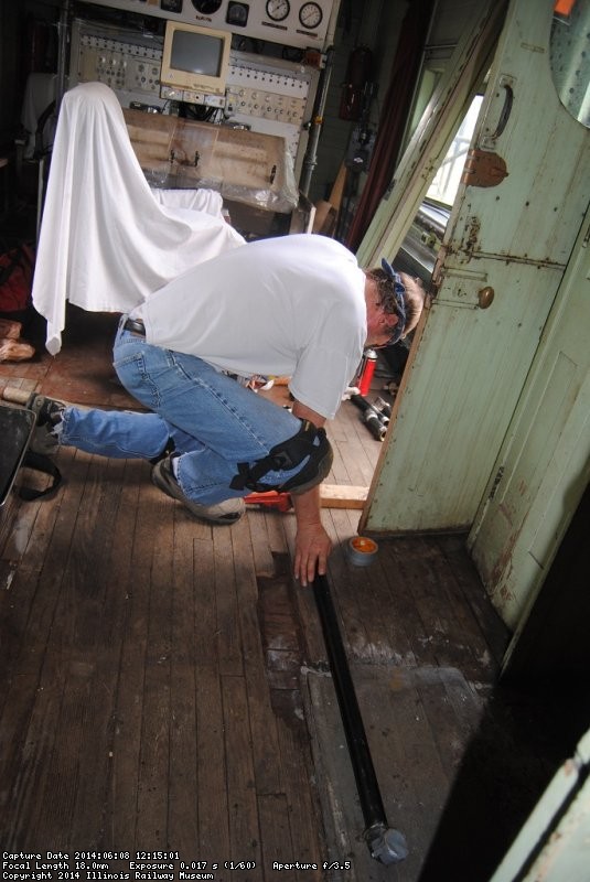 Chuck Trabert repairing pipe in the Dynamometer - Photo by Shelly Vanderschaegen