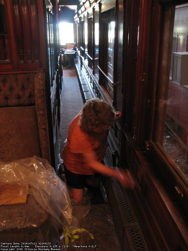 Shelly Vanderschaegen buffing wax in the Ely dining room - Photo by Pauline Trabert