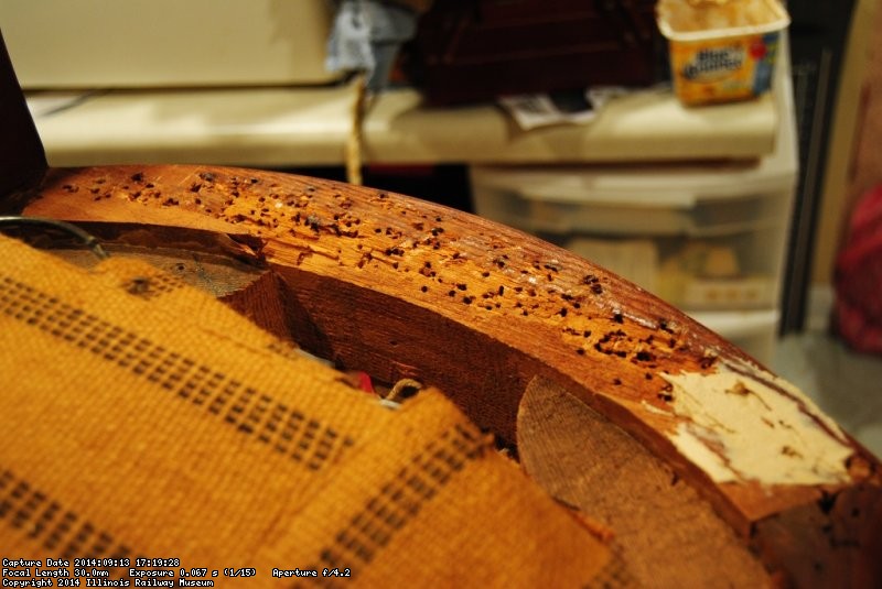 Many tack holes in the Lounge Car seat frame - Photo by Shelly Vanderschaegen