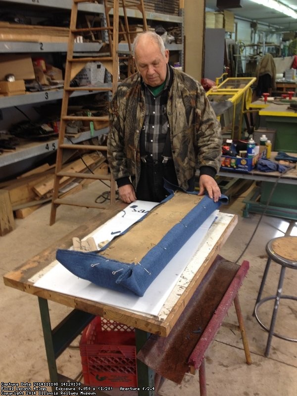 John McKelvey pinned new material to a previously stripped Santa Fe Lounge Car seat - Photo by Michael McCraren