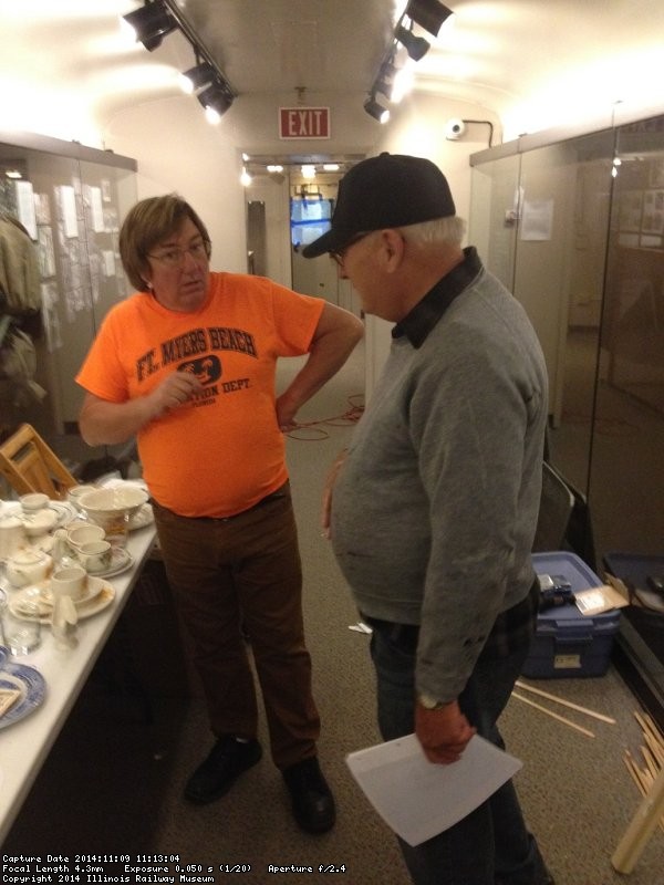 Mark and Jim Windmeier discuss ideas for the china display - Photo by Michael McCraren
