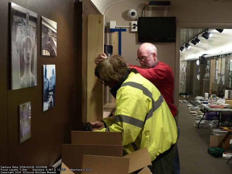 Mark and Jon removing a board to install the top of the display cabinet being added to the exhibit car - Photo by Brian LaKemper