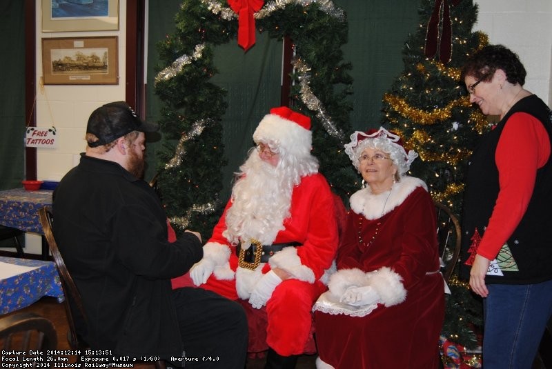 David visits with Santa and Mrs. Claus as Susan Stepek looks on - Photo by Shelly Vanderschaegen