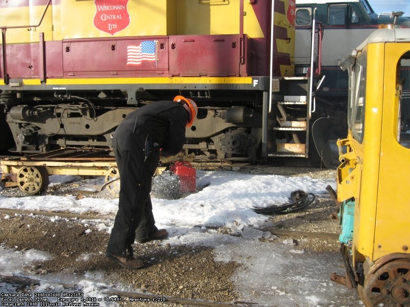 Frank chipping ice from the railhead