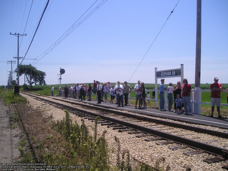 Passengers at Forest Park wait for the next Westbound car to arrive.