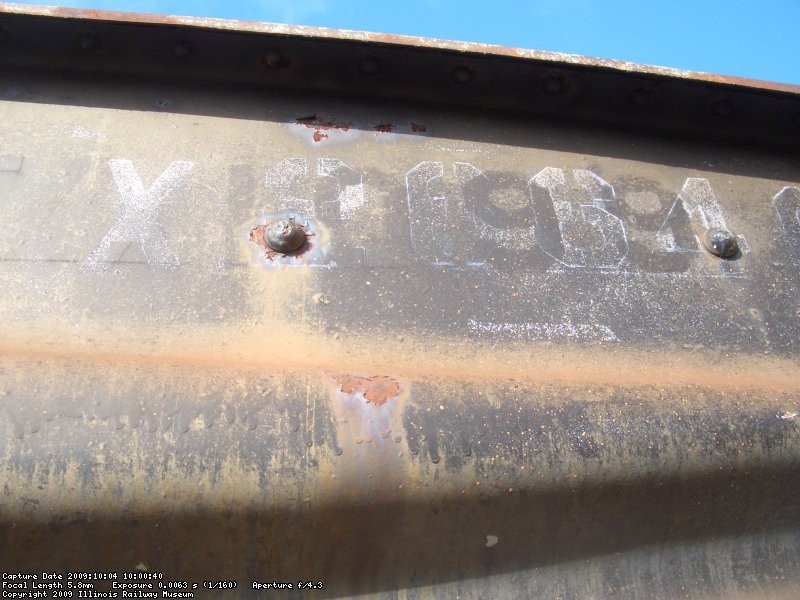 10.04.09 - AS I CONTINUED TO NEEDLE CHIP THE "A" END OF THE CAR, I CAME ACROSS THE CAR'S PREVIOUS NUMBER, URTX 1099.  THIS WAS PROBABLY THE NUMBER WHEN IT WAS STILL AN ICE BUNKER REEFER.