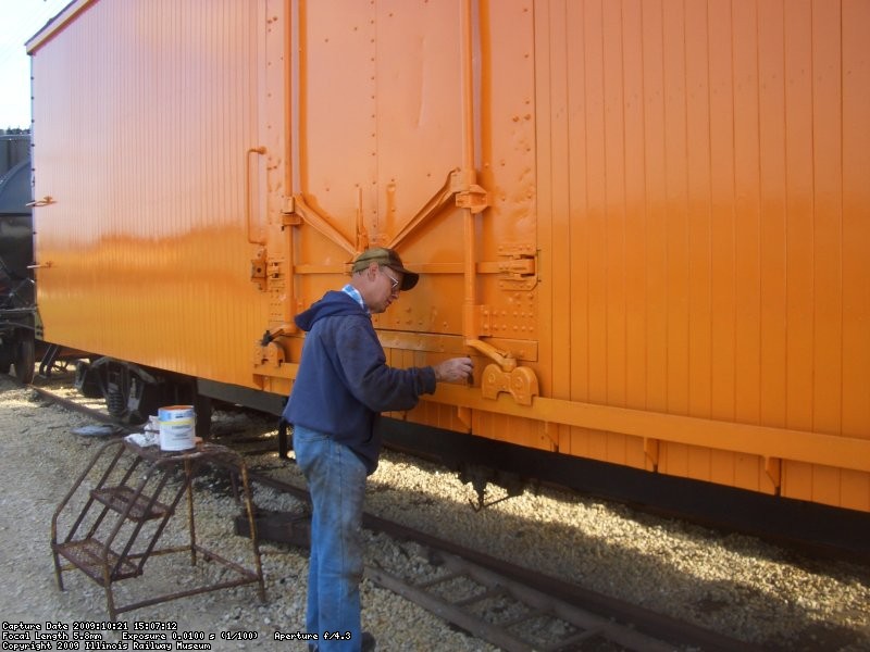 10.21.09 - VICTOR DOES MORE TOUCH-UP ON THE ORANGE.  HE ALSO PAINTED THE STEEL MEMBER BELOW THE DOOR BLACK.