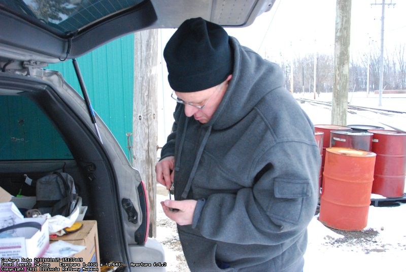 Marcus cleaning up the block heater mount.