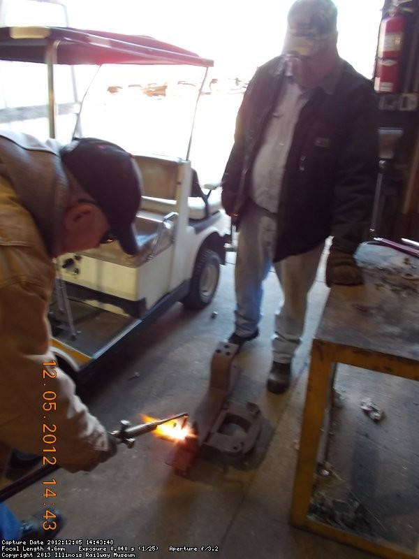 Gerry using "torch" to cut off old bolt,  12-5-12