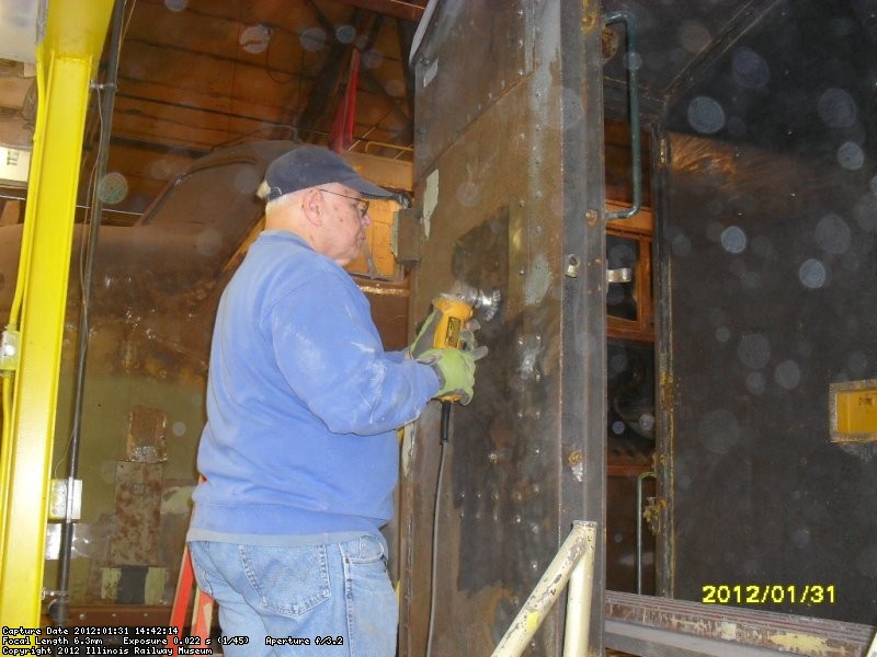 Joe using wirewheel to smooth steel in prep for future priming 1-31-2012