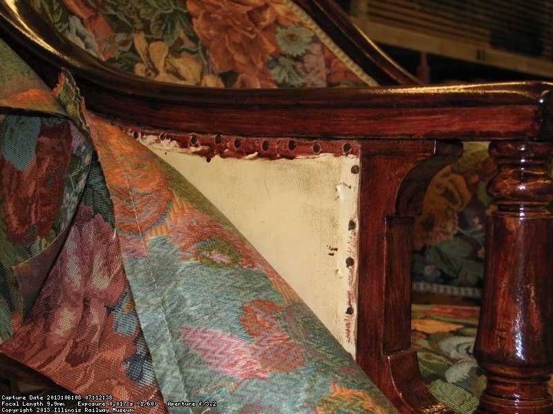 John applied stain to the woodwork and left the original upholstery intact underneath his work.