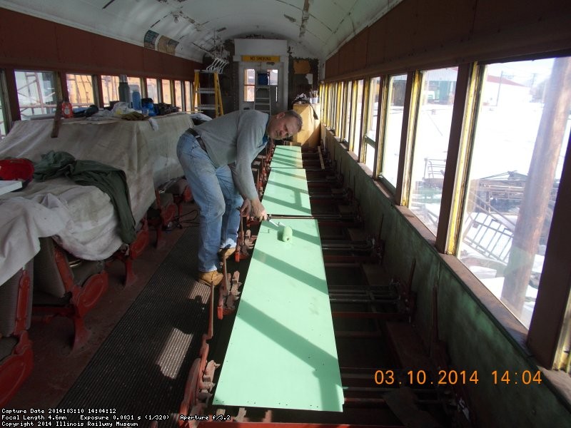 Here's Roger applying second coat of topcoat  3-10-14     It's not the correct  green but something I found in one of the old coaches. Nice color  DSCN0758