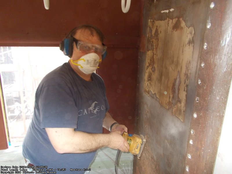  Dave Cook sanding bulkhead wall at East end  of coach  DSCN0827
