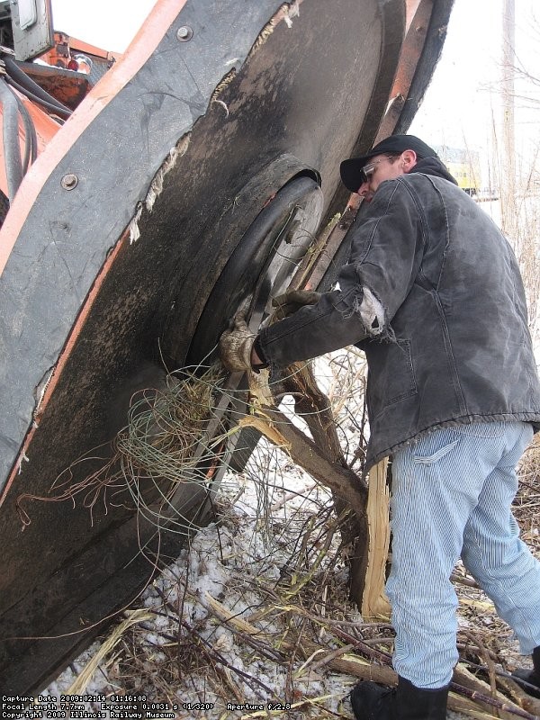 Removing a large chuck of line wire hidden in in the weeds along the tracks...