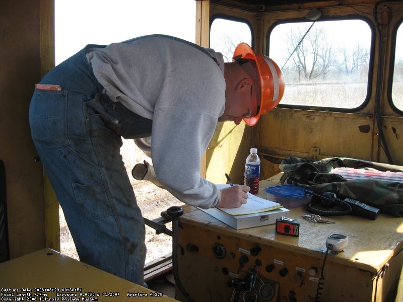 Frank filling out inspection forms in the J 585