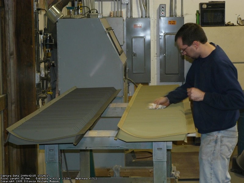 Kyle wiping the DB louvers to get them ready for paint.