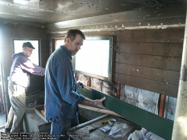 02.13.05 - VICTOR HUMPHREYS AND BUZZ MORISETTE INSTALL NEW INTERIOR SIDING WHICH BUZZ HAD MILLED FROM RAW WOOD.