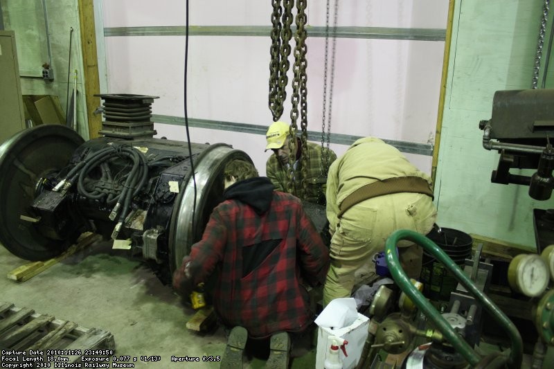 Jamie, Dan and Roger mounting the roller bearings on the end of the axle.