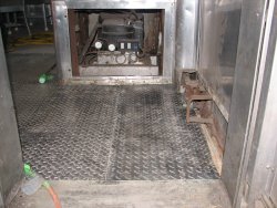 Corrugated steel reapplied over the repaired floor. 