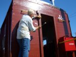 09.02.07 - KIRK WARNER APPLIES THE TRIM TO THE A DOOR OF THE CABOOSE.