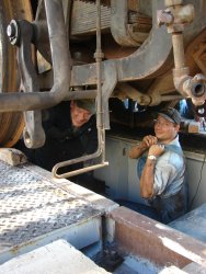 Steam department volunteer Collin crawled in between the frame of the locomotive to watch for potential problems during the drop 