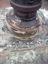Closeup of flashings around the kitchen water tank fill pipe