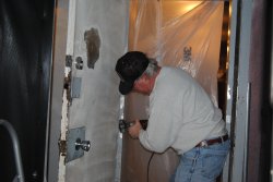 Kevin removing the high spots in the vestibule