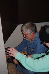 Mike and Shelly apply a vent cover to the new opening