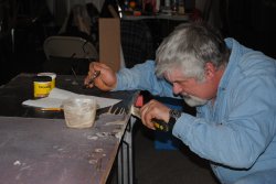 Mike Baksic applying epoxy to the vestibule closet door 2/16/14