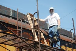Chuck Trabert patching the X-5000 roof - Photo by Shelly Vanderschaegen
