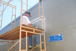 Kevin Kriebs continues adhesive removal on the 1st Exhibit Car - Photo by Shelly Vanderschaegen
