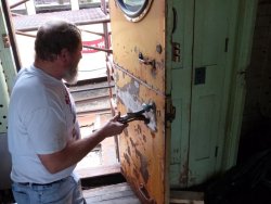 Chuck Trabert working on the south door of the Dynamometer - Photo by Brian LaKemper