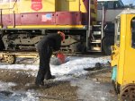 Frank chipping ice from the railhead