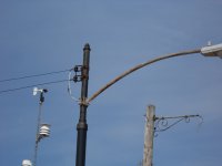 Newly installed steel pole fitted with 1950's era Chicago style pole extension and 8' street light arm.