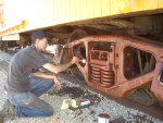 06.28.09 - JOHN BALETTO IS PRIMING THE AR TRUCK WHICH HE HAS NEEDLE CHIPPED AND WIRE WHEELED TO PREPARE IT FOR PAINT.