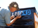 06.30.10 - BOB KUTELLA IS PAINTING ON THE CAR NUMBER ON THE "A" END OF THE CAR.
