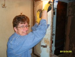 Nancy helps start the project in women's bathroom 4-20-12